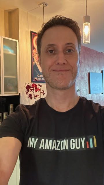 A man wearing a t-shirt that says "My Amazon Guy" showcases expertise in marketing management and seller central management.