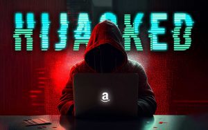 A man in a hoodie sitting at a laptop with the words hacked on it, engaged in marketing management.